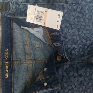 Much Kors women's navy flare jeans floral cropped